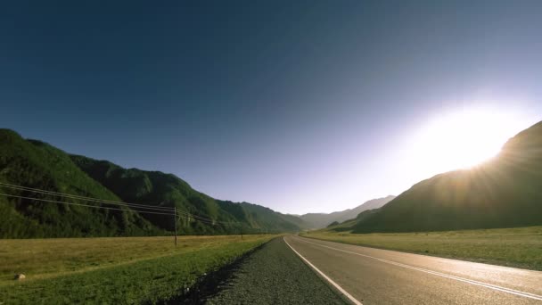 Mountain road timelapse at the summer or autumn sunset sunrise time. Wild nature and rural field. — Stock Video