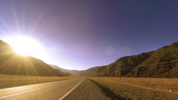 Mountain road timelapse at the summer or autumn sunset sunrise time. Wild nature and rural field. — Stock Video