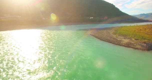 Low altitude flight over fresh fast mountain river with rocks at sunny summer morning. — Stock Video