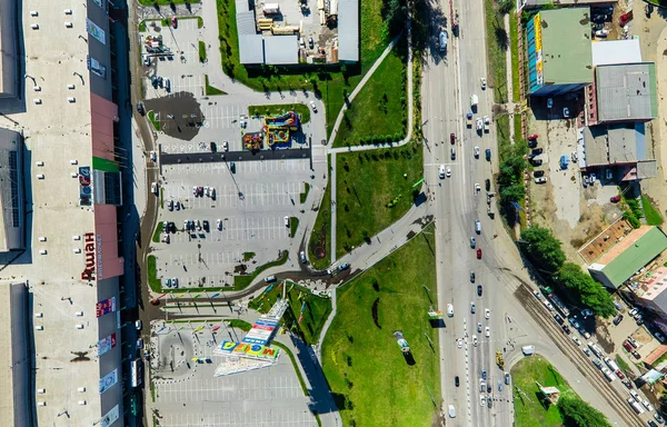 Aerial city view with crossroads and roads, houses buildings. Copter shot. Panoramic image. — Stock Photo, Image