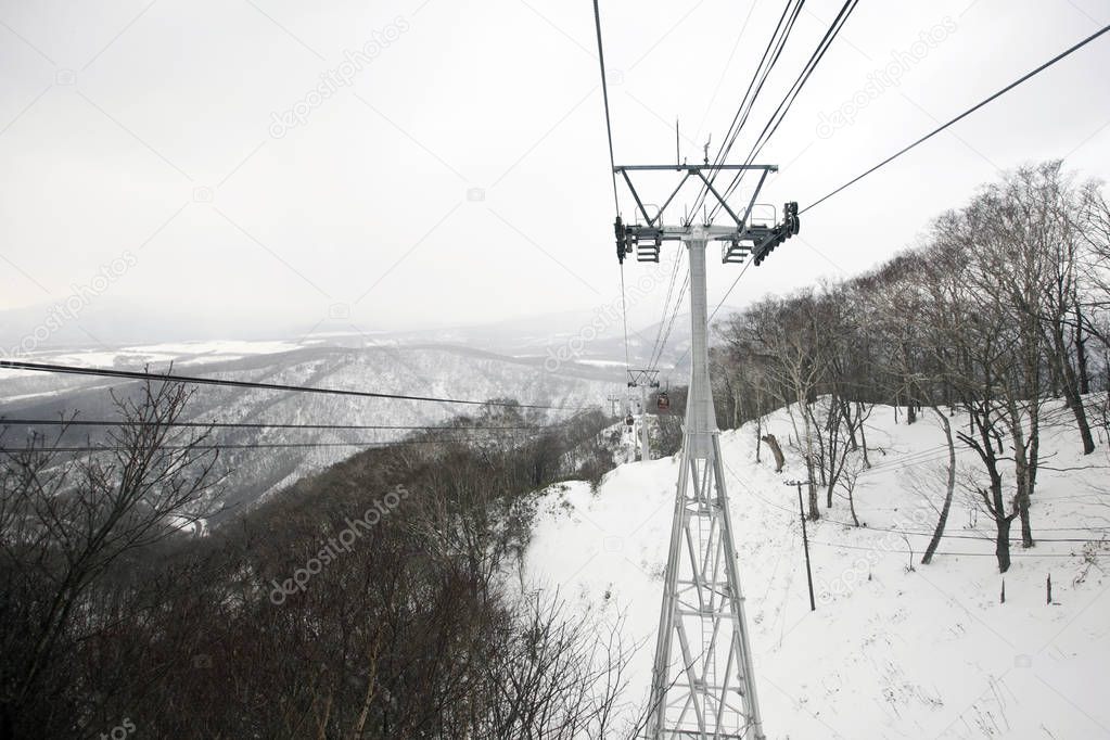 The cable car was climbing to the ropeway station on the summit of Moiwa mountain