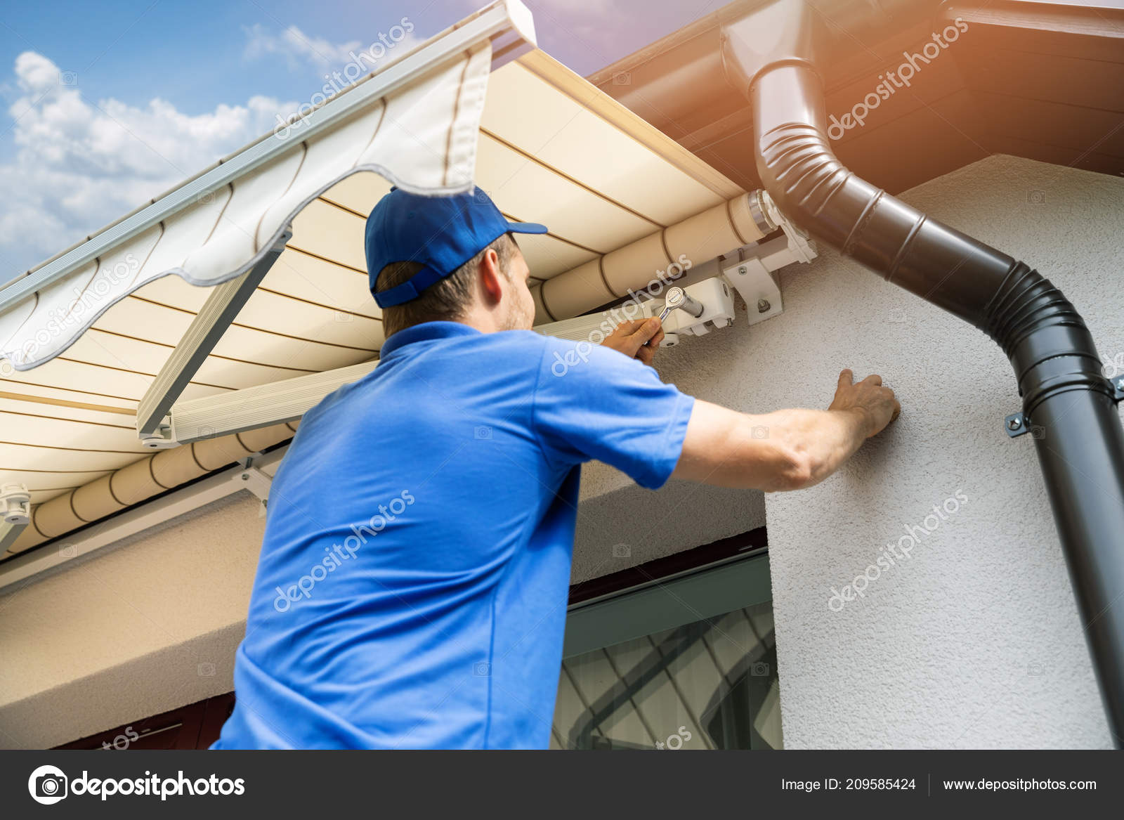 Man Installing Awning House Facade Wall Balcony Window Stock Photo by ©ronstik 209585424