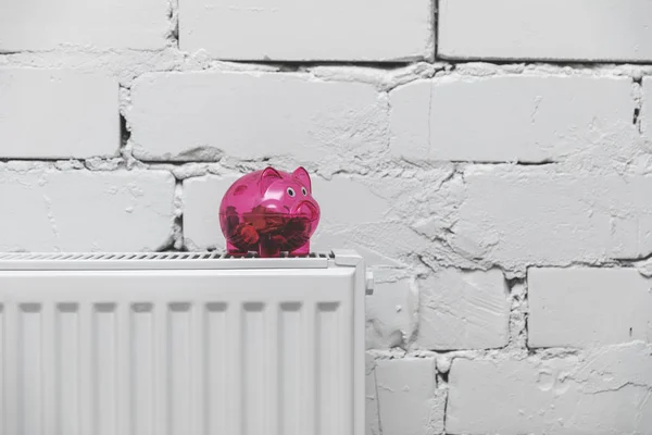 Heating Costs Piggy Bank Radiator Front White Brick Wall — Stock Photo, Image