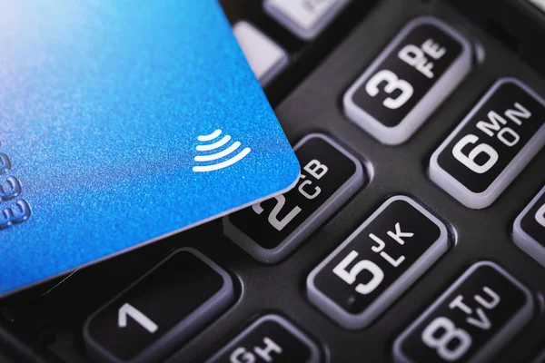 contactless payments - credit card on payment terminal