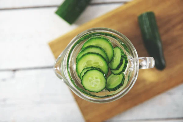 glass pitcher with fresh cucumber water. top view