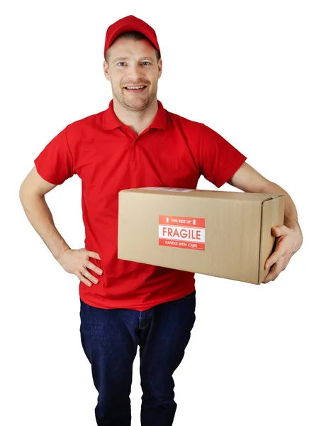 Delivery service courier in red uniform with fragile shipment bo — Stock Photo, Image