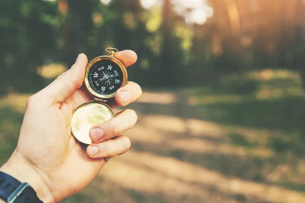 Orienteering in the woods compass in the hand — Stock Photo, Image