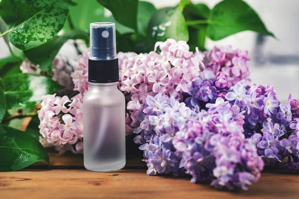 sprayer bottle with lilac scent and blossom