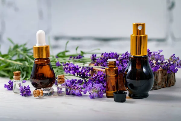 Lavender perfume - essential oil and scent bottles with flowers — Stock Photo, Image