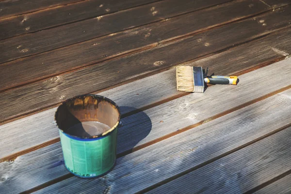 Restore old wooden terrace with wood protective oil — Stock Photo, Image