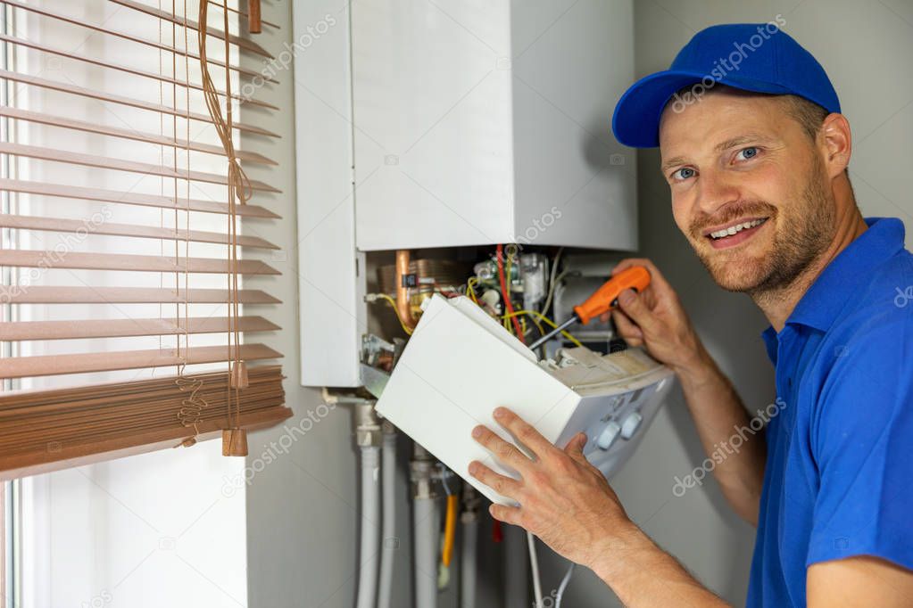 smiling maintenance and repair service engineer working with hou
