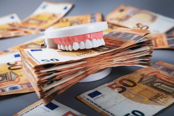 Greedy people and materialism concept. mouth full of money — Stock Photo, Image
