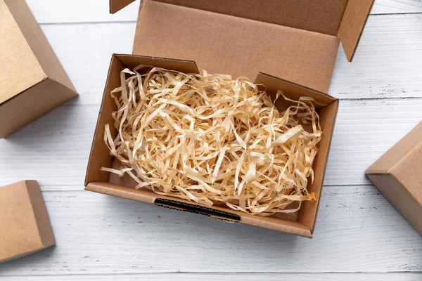 Packaging Design Cardboard Box Wood Shavings Top View — Stock Photo, Image