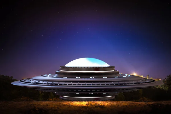 3d rendering metal ufo or alien spaceship on field