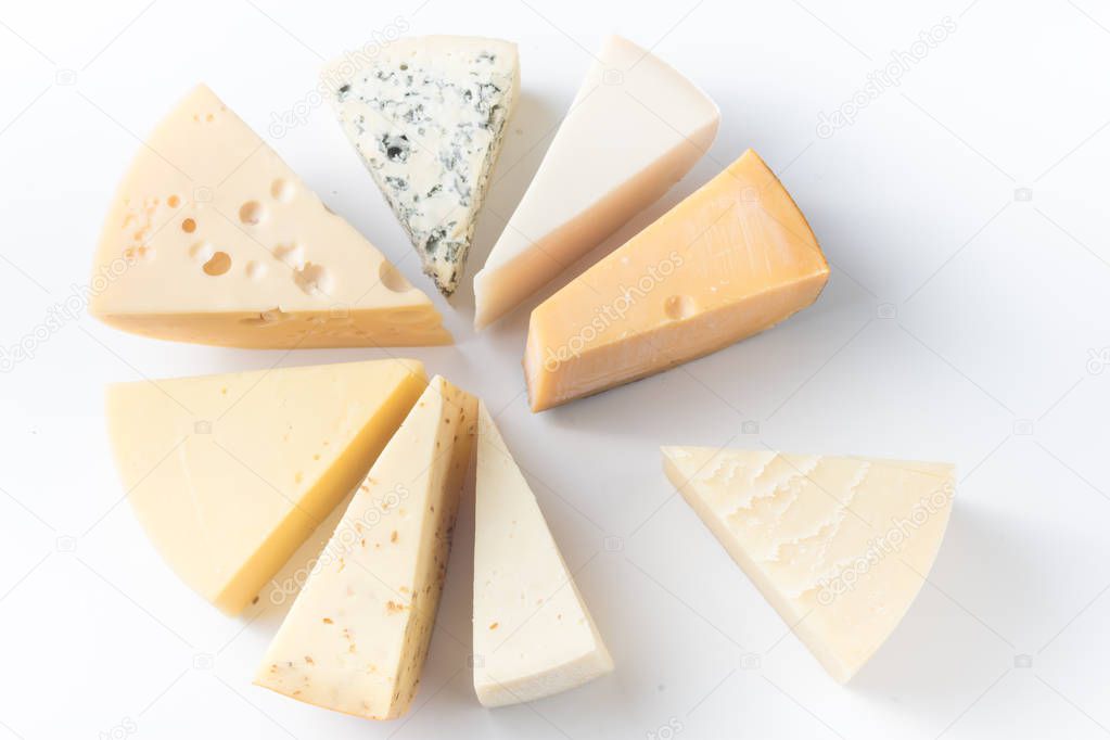 Various types of cheese isolated on white, top view