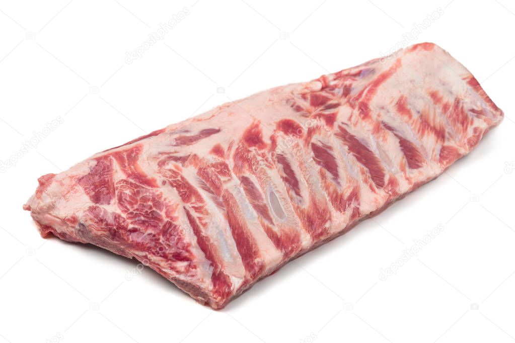 A rack of uncooked pork spare ribs. Isolated on white background.