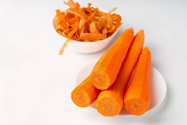 Peeled fresh carrots isolated on white background — Stock Photo, Image