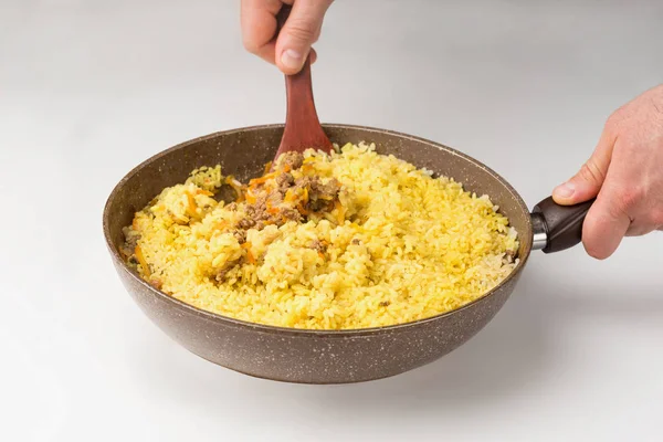 Frying pan full of yellow rice minced meat on white — Stock Photo, Image