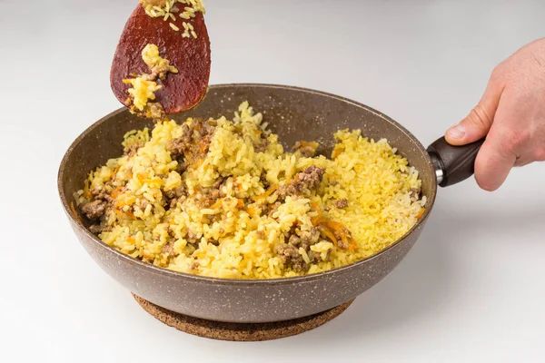 Frying pan full of yellow rice minced meat on white — Stock Photo, Image