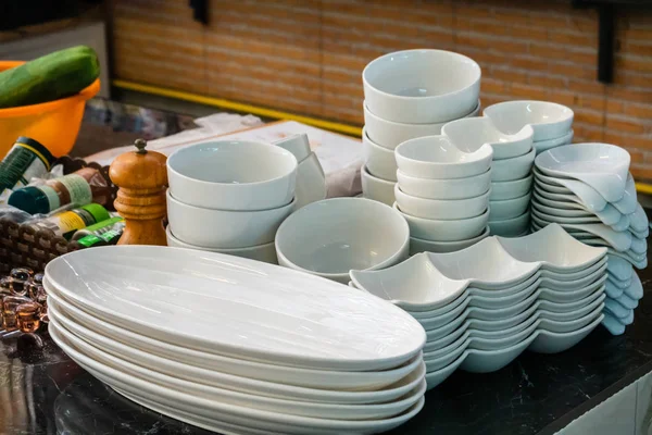 Stack of cleaned dishes in a restaurant room — Stock Photo, Image