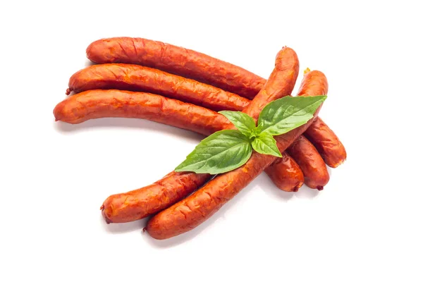 Dry Sausages with basil leaves, close-up, isolated on white back — Stock Photo, Image