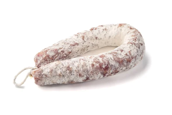Delicious dry sausage on a white background. Stock Image