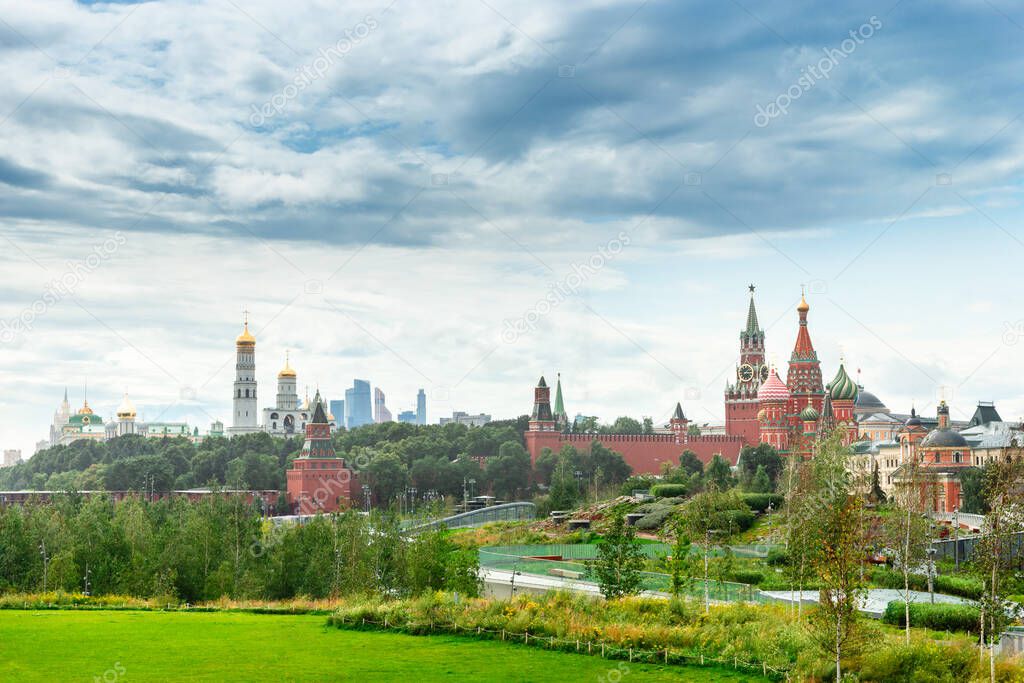Zaryadye Park overlooking the Moscow Kremlin and St Basil's Cathedral, Russia. Zaryadye is the one of the main tourist attractions of Moscow. Panoramic scenic view of Moscow centre in summer.