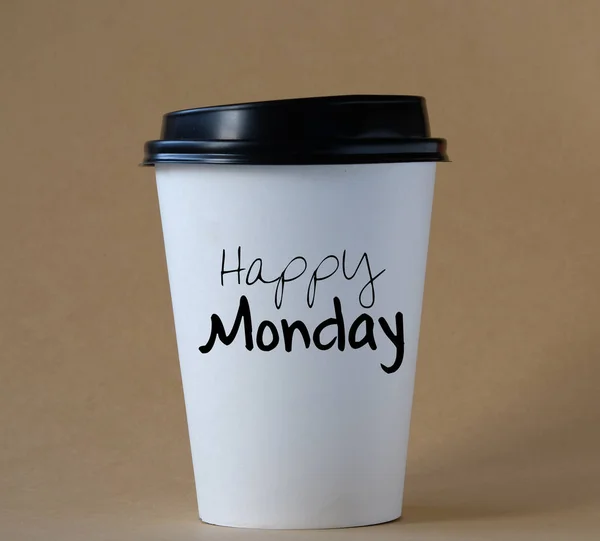 HAPPY MONDAY. Happy monday text on a cup of coffee.