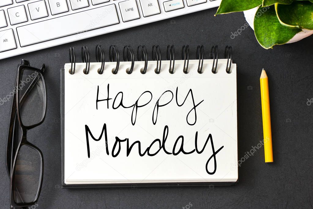 Happy monday text or notepad on table 