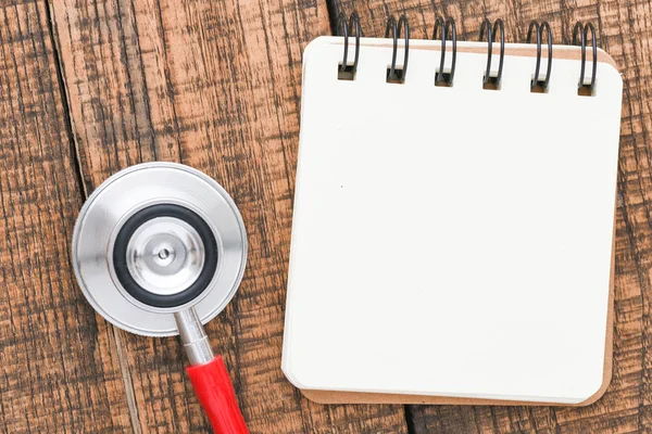 Top View Stethoscope Empty Notepad Wooden Table — Stock Photo, Image