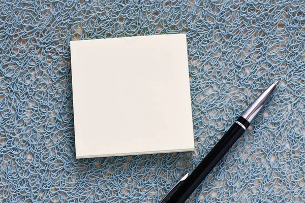 blank notepad and pen, top view