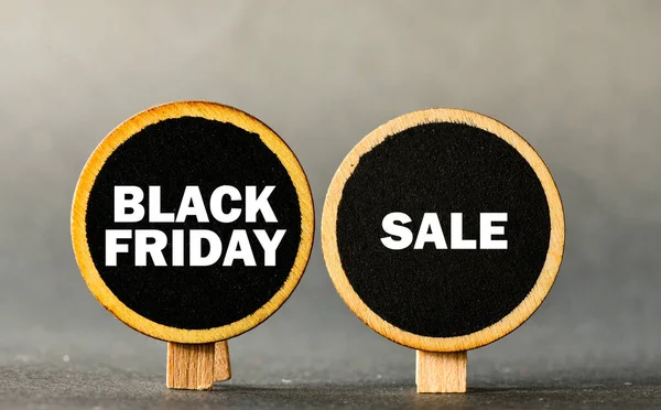 Black friday sale labels on wooden table