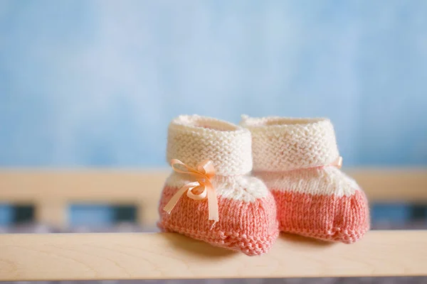 Baby booties cot gentle care concept