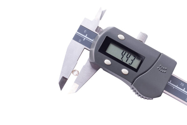 faceted diamonds in a callipers on a white background