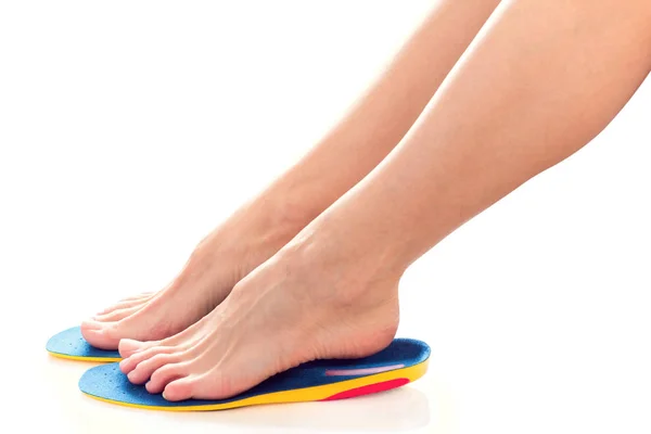 Feet and orthopedic insoles — Stock Photo, Image