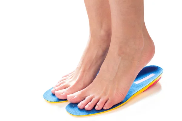 Feet and orthopedic insoles — Stock Photo, Image