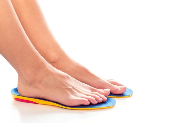 Feet and orthopedic insoles — Stock Photo, Image