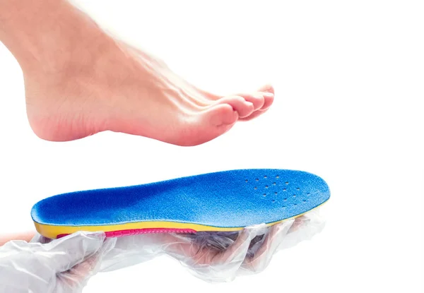 Orthopedic insole in the hands — Stock Photo, Image