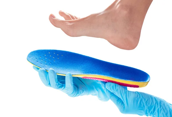 Orthopedic insole in the hands — Stock Photo, Image