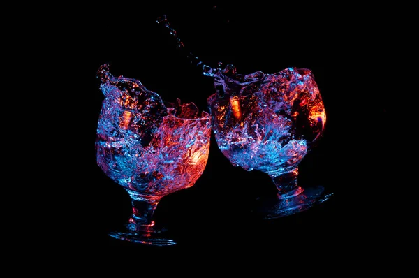 Toast of two fancy glasses on black background — Stock Photo, Image