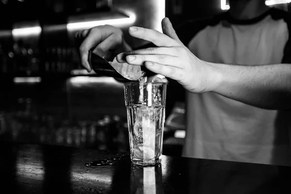 Cocktails by a barmen in a nightclub - Bartender skills are shown