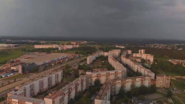Aerial top view of storm coming arriving at a district of Soviet design - Sunset in european capital Riga, Latvia - Urban Landscape scenery with professional smooth movement and camera angles — Stock Video