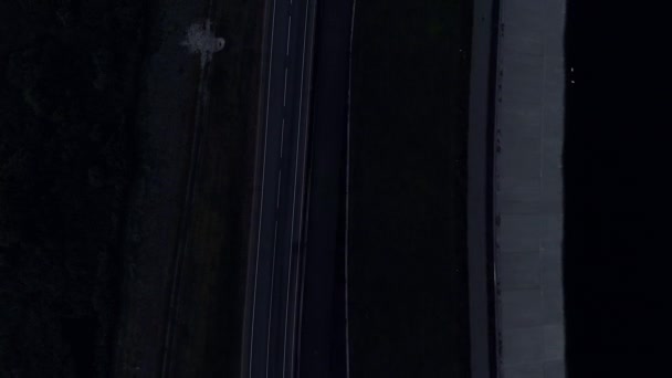 Aerial Flying over the road with cars and trucks in the evening — Stock Video