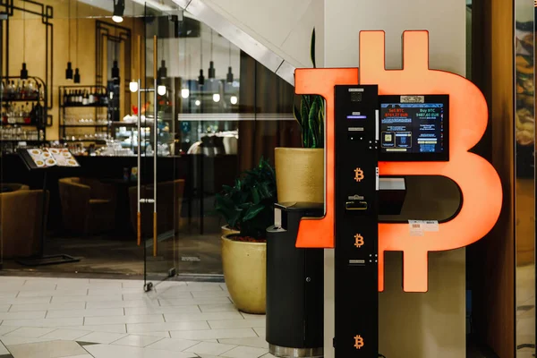 Bitcoin ATM machine in mall for cryptocurrency exchange Stock Image