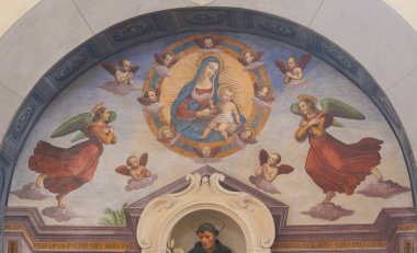 San Gimignano, Italy - July 11, 2017: Fresco of Blessed Virgin Mother Mary and Angels in the Church of Sant Agostino in San Gimignano, Tuscany, Italy clipart