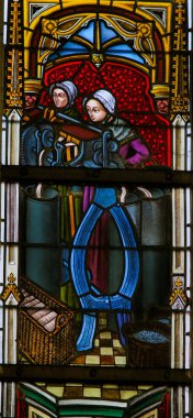 Ghent, Belçika - 23 Aralık 2016: Ghent, Flanders, Belçika içinde Saint Bavo Katedrali tekstil sektöründe tasvir vitray pencere.