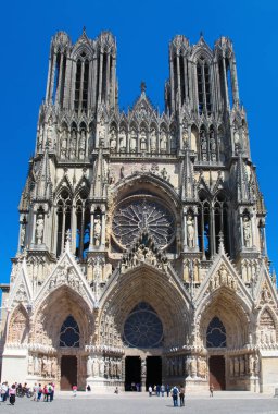 Reims, France - July 3, 2014: Reims Cathedral in the Champagne region, France, a famous High Gothic Catholic church that receives over a million tourists per year. clipart