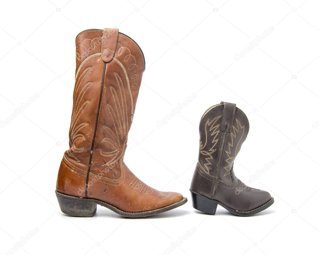 Brown cowboy boots isolated on a white background.