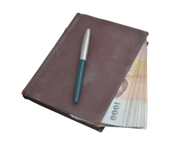 Banknotes, pen, diary book isolated on a white background. — Stock Photo, Image