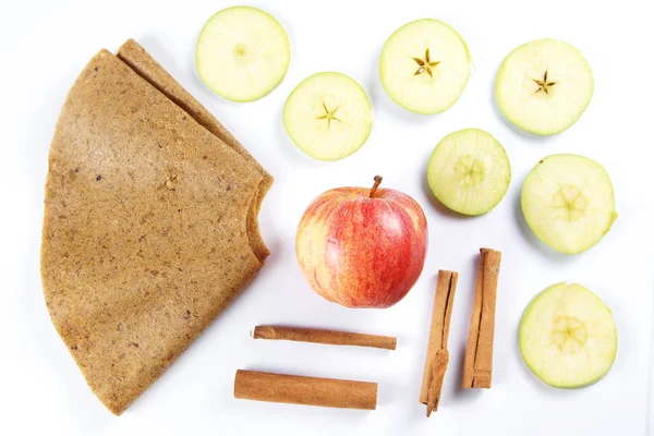 Ingredients for fruit pastille made of cinnamon and apples on white background